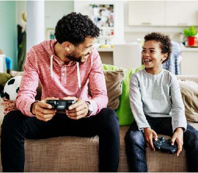 Parent playing a video game with child