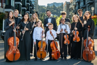 Members of the Metropolitan Youth Symphony in a group photo in downtown Portland