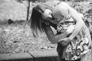 An adult hugging a child