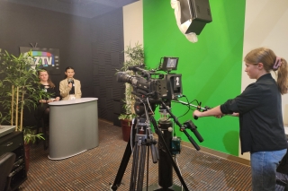 Children on the set of a newstation