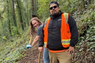 Two people in Forest Park doing trail maintenance