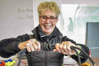 Portland Neighborhood Emergency Team volunteer tying a rope knot