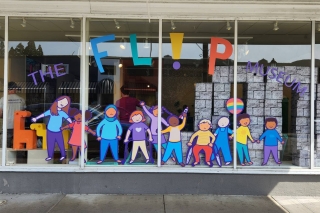 The Flip Museum painted on windows