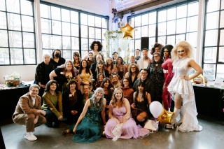 A group photo of people dressed up for a Quest Center fundraiser