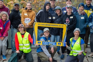 United Way Columbia-Willamette volunteers holding a frame that says This Is What Awesome Volunteers Look Like. Hands On Greater Portland. Community Impact Week.