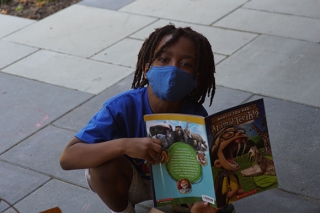 Children's Book Bank boy reading Animal Teeth