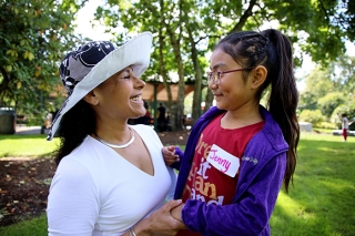 Woman and girl smiling together