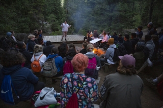 Photo of people at a campfire