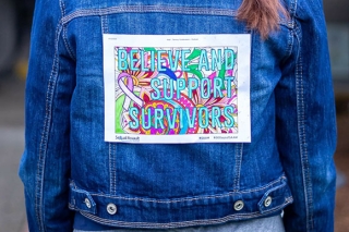 Photo of Believe and Support Survivors on the back of a jean jacket