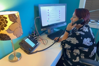 Photo of a woman working the support line