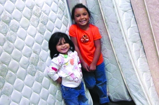 Photo of two girls with mattresses