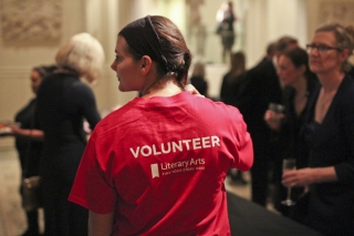 Photo of woman wearing a Literary Arts volunteer t-shirt