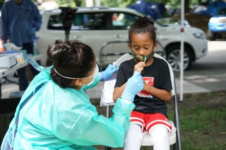 Photo of a girl getting a COVID-19 test