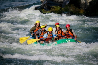 Photo of young people rafting