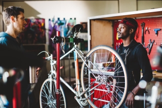 Photo of man repairing a bike