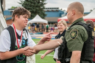 Photo of a young man meeting a sheriff