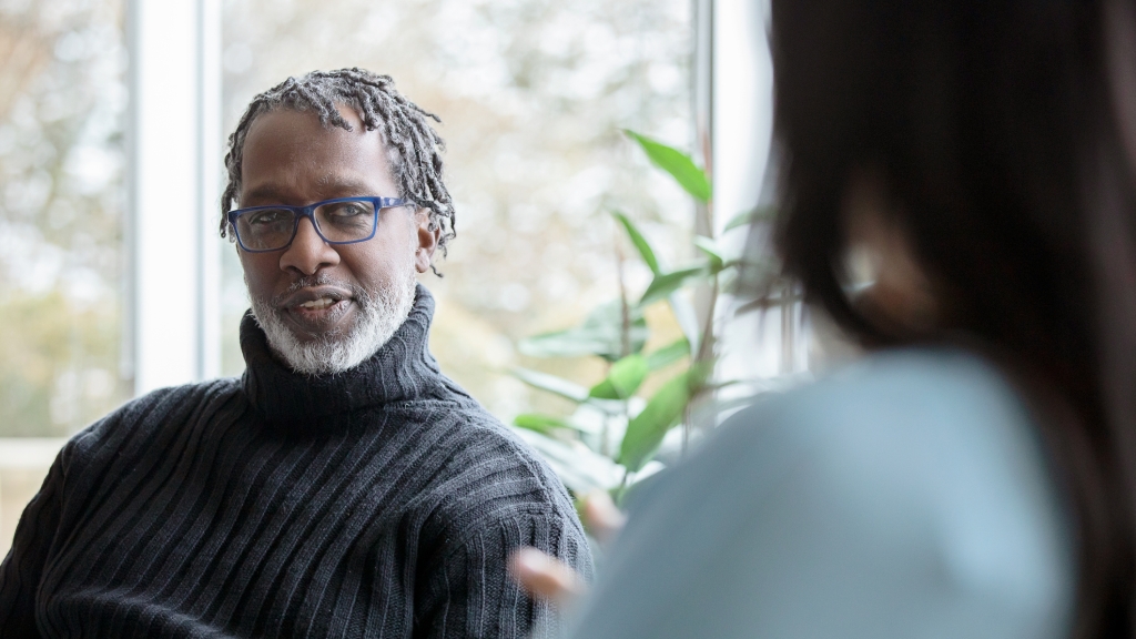 Business casual manager giving advice to an employee