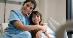 A female doctor with a young girl patient