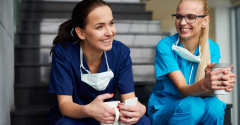 Two female doctors taking a coffee break