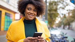 A woman holding her cell phone