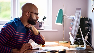 Thumbnail of man working at home