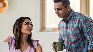 Social Media Toolkit: Highlight Our Calculator During DIAM A couple looking at a laptop