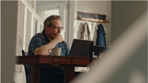 Social Media Toolkit: Help Protect Client Income With Platinum Advantage Doug working on a laptop