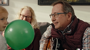 Social Media Toolkit: Help Protect Client Income With Platinum Advantage Doug playing the guitar with his grandchild