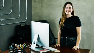 Social Media Toolkit: Comprehensive Coverage for Business Owners A woman standing at her desk