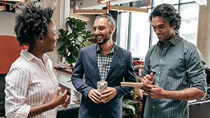 Social Media Toolkit: Share the Value of Business Protection Colleagues talking in an office