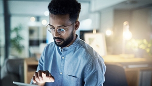 A person using a tablet in an office