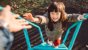 Social Media Toolkit: Find Freedom With the Family Care Benefit A young girl climbing up rungs