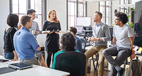 Employer Best Practices Colleagues talking in an office
