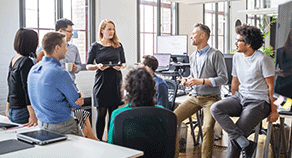 Colleagues talking in an office