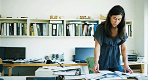 Long COVID's Impact A woman in her office